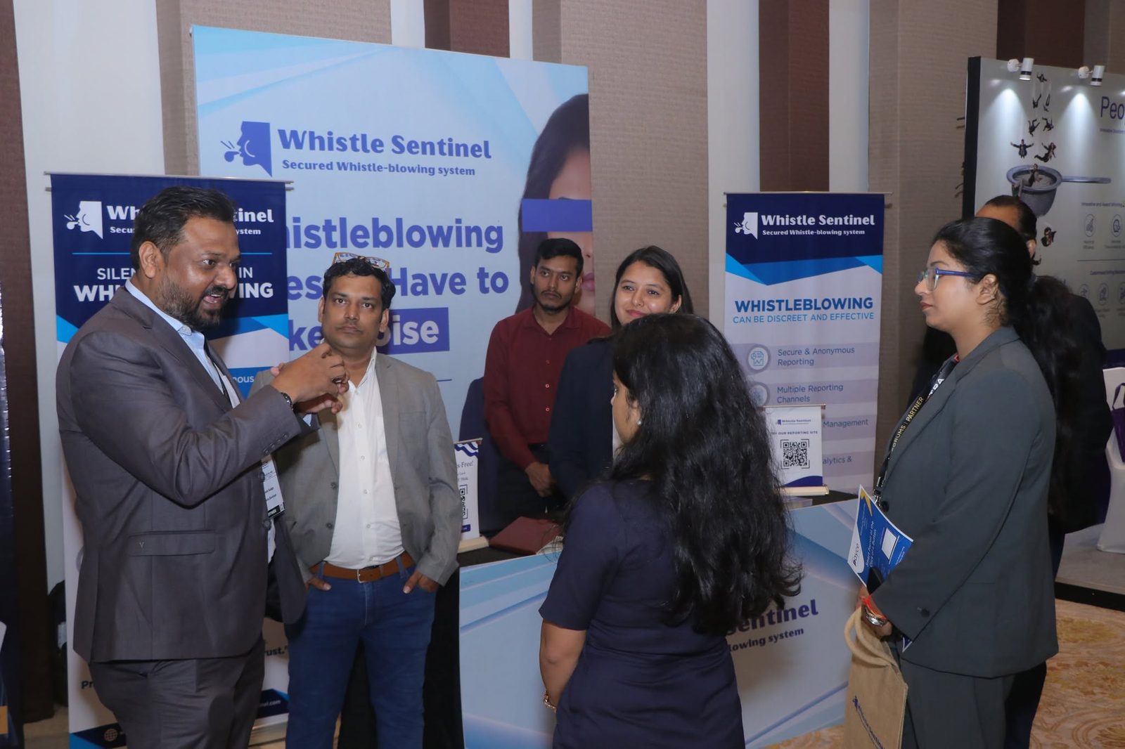 The WhistleSentinel team connecting with partners and organizations at an industry event
